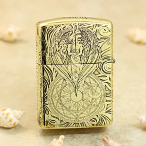 KZ211-01 Gold engraved Zippo lighter with an angel wings design above a circular geometric seal from the engraving on the front surface.