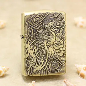 Brass Zippo-style lighter with an intricate carved dragon and floral design on the front.