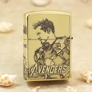 KZ241-01 Gold-colored lighter featuring a stylized Avengers illustration and the Avengers logo at the bottom.