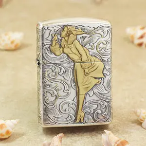 Shiny Zippo-style lighter with a gold-toned man in a coat drinking, set against a swirling silver background.