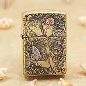 Brass lighter with an intricate engraved scene of a woman, a wolf, flowers, and a butterfly.