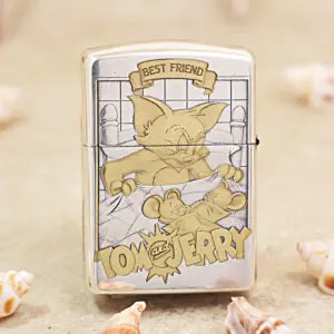 Shiny metal Zippo lighter with a Tom and Jerry cartoon — Tom in a bathtub and two mice, with a 'Best Friend' banner above and 'Tom and Jerry' text below, in retro style.