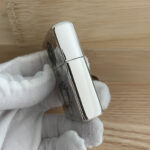 Polished side profile of the Guanyin sterling silver Zippo Armor case