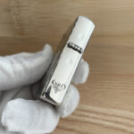 Hinge-side flame motif on the Guanyin sterling silver Zippo Armor lighter