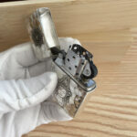 Open Guanyin sterling silver Zippo Armor lighter with hammered relief