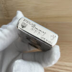 Sterling silver and Armor bottom stamp on the Guanyin Zippo lighter