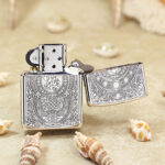 Open reverse view showing circular emblems and five-side engraving on the sterling silver Zippo lighter