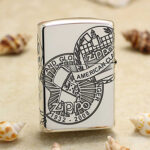 Reverse view with Zippo globe and 1932-2008 heritage graphics on the sterling silver lighter