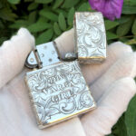 Open reverse view showing 1933 Varga Girl lettering on the sterling silver Zippo Armor lighter