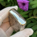 Angled polished top view of the Varga Girl sterling silver Zippo Armor lighter