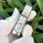 Hinge-side arabesque engraving on the Varga Girl sterling silver Zippo Armor lighter