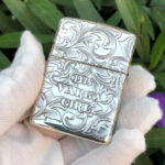 Angled reverse view of the 1933 Varga Girl sterling silver Zippo Armor lighter
