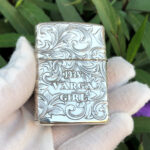Centered reverse view of the 1933 Varga Girl arabesque sterling silver Zippo Armor lighter