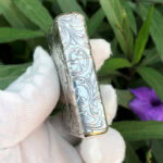 Narrow-side scroll engraving on the Varga Girl sterling silver Zippo Armor lighter