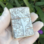 Straight front view of the Varga Girl five-side engraved sterling silver Zippo Armor lighter