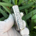 Opposite narrow-side scroll engraving on the arabesque woman sterling silver Zippo Armor lighter