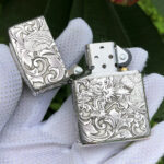 Open front view showing dragon, phoenix, arabesque engraving, and Zippo insert