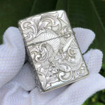 Reverse view with phoenix and flowing arabesque engraving on the sterling silver Zippo Armor lighter
