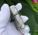 Hinge-side engraving on the dragon and phoenix sterling silver Zippo Armor lighter