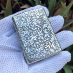 All-over arabesque engraving on the reverse of the sterling silver Armor case