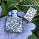 Open Arabesque sterling silver Zippo Armor lighter showing reverse engraving
