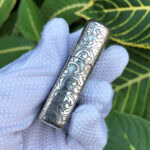 Opposite side scroll engraving on the Arabesque Cross sterling silver lighter