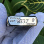 Close-up of the sterling silver and Armor base marking on the Arabesque lighter