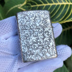 Arabesque engraving across the back of the sterling silver Armor case