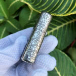 Rounded side profile of the engraved sterling silver Zippo Armor case