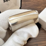 Rounded top edge of the brushed sterling silver Zippo #13 case