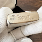 Close-up of the Zippo #13 sterling silver base marking