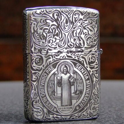 Front view of sterling silver Zippo with St. Benedict figure and ornamental engraving