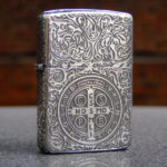 Reverse of sterling silver Zippo with St. Benedict cross medal and scrollwork