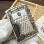 Game of Thrones five-side sterling silver Zippo lighter – reverse view showing Night's Watch text and heraldic engraving