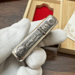 Game of Thrones five-side sterling silver Zippo lighter – opposite side with house motto lettering and ornamental emblems