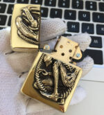 H.R. Giger Alien brass Zippo lighter with skeletal and mechanical engraving