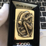 Open H.R. Giger Alien Anniversary Zippo lighter reverse view