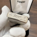 Sterling silver and Armor bottom stamp on the Zippo #27 lighter