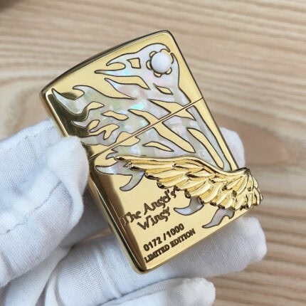 Gold-tone Angel Wings Zippo with pale reflective graphic, white round accent and 0173/1000 marking