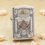 Freemasonry limited-edition sterling silver Zippo Armor lighter – front view showing the all-seeing eye, temple, and square-and-compasses emblem