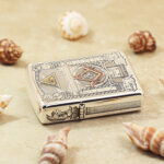 Freemasonry limited-edition sterling silver Zippo Armor lighter – horizontal view showing the lid, hinge, and wraparound lodge-symbol engraving