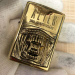 H.R. Giger Alien Emblem No. 2 high-polish brass Zippo lighter front view