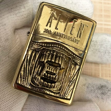 H.R. Giger Alien Emblem No. 2 high-polish brass Zippo lighter front view