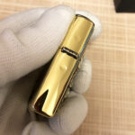 Alien Emblem No. 2 Zippo lighter base stamp beside original box