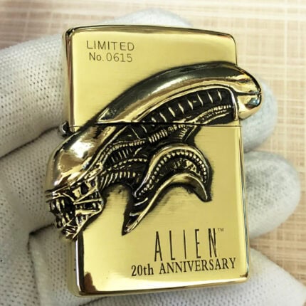 H.R. Giger Alien Emblem No. 3 high-polish brass Zippo lighter front view