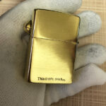 H.R. Giger Alien Emblem No. 3 brass Zippo lighter alternate angle