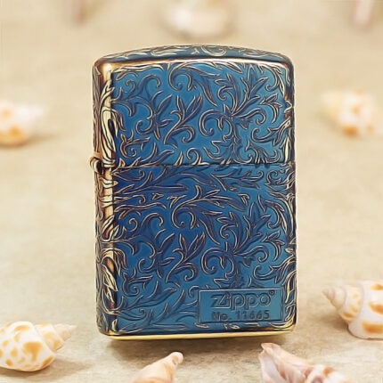 Smoked-blue Armor arabesque Zippo with gold-tone highlights and serial panel