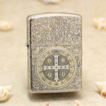 Front view of high-polish chrome Zippo Armor with St. Benedict cross engraving