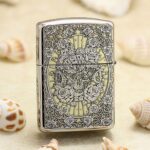 KZ129 polished chrome Zippo Armor lighter with skeletal gentleman framed by roses