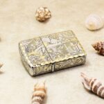 Windy pin-up arabesque Zippo Armor lighter lying flat